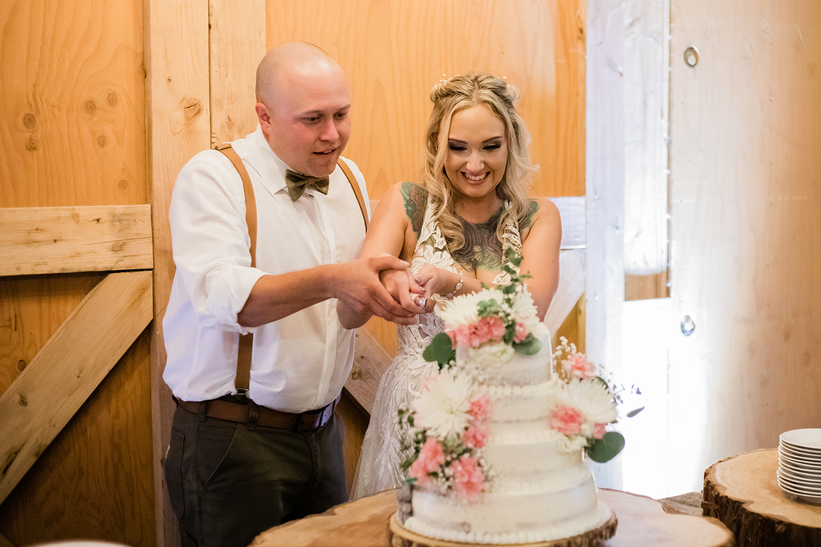 Wedding cake cutting at Rein Fire Ranch Wedding