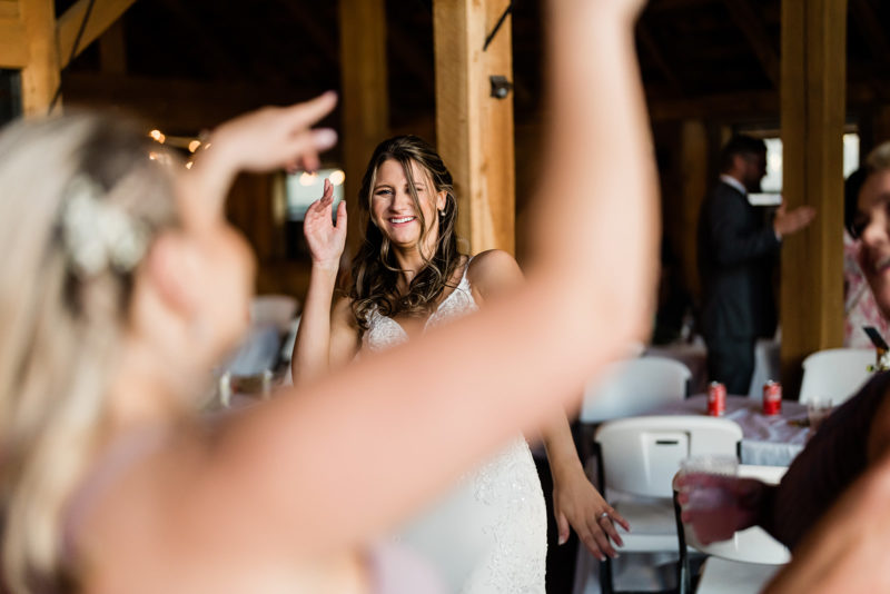 Guests dancing at a Cattle Barn Wedding