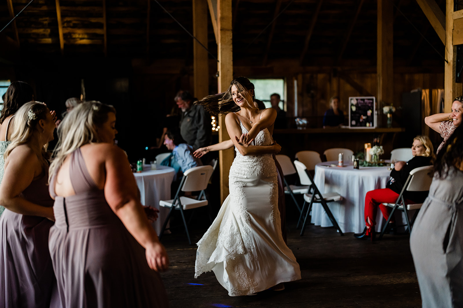 Bride dancing at her Cattle Barn Wedding
