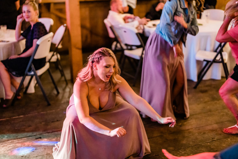 Bridesmaid twerking at a Cattle Barn Wedding