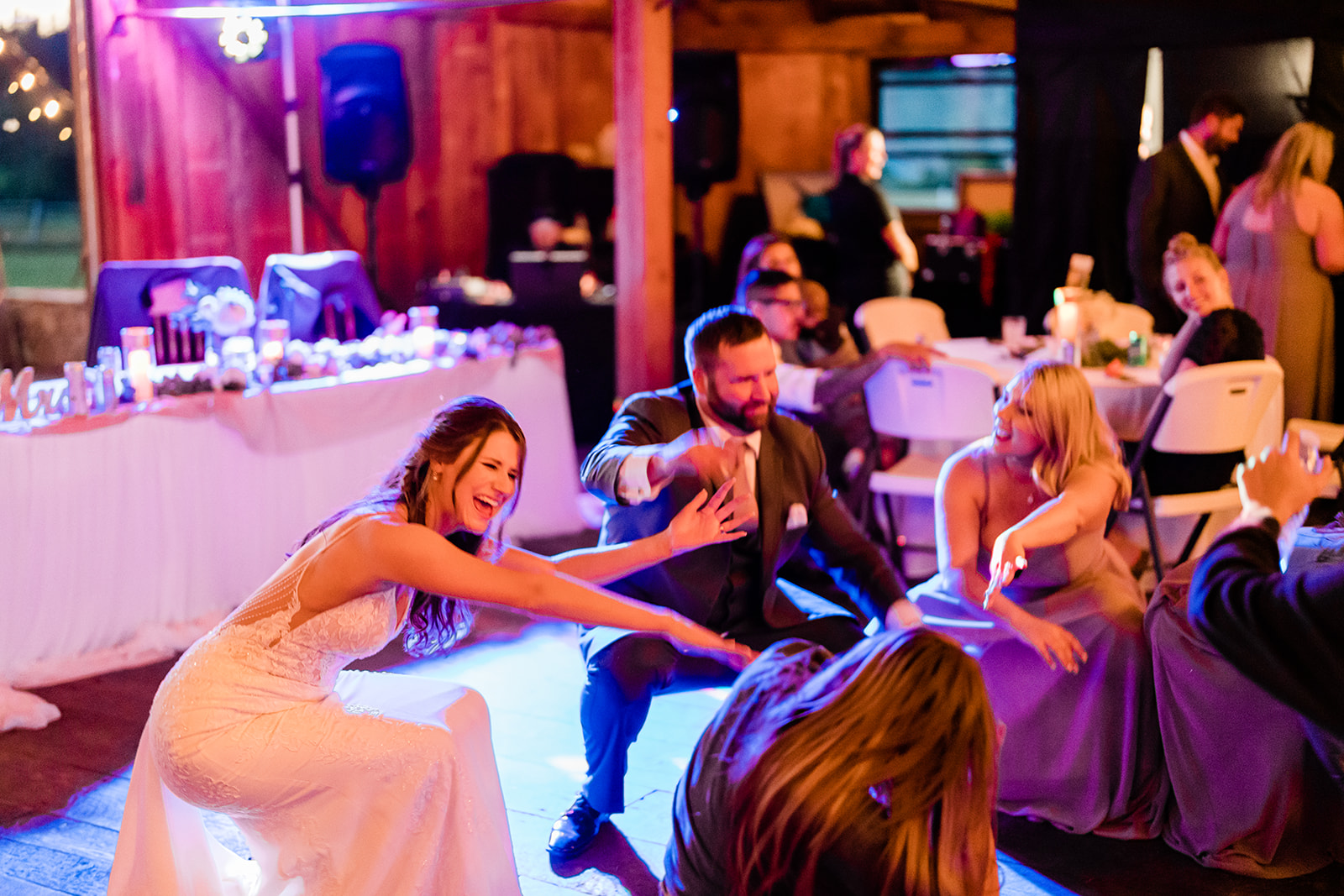 Couple and Bridal team dancing at a Cattle Barn Wedding