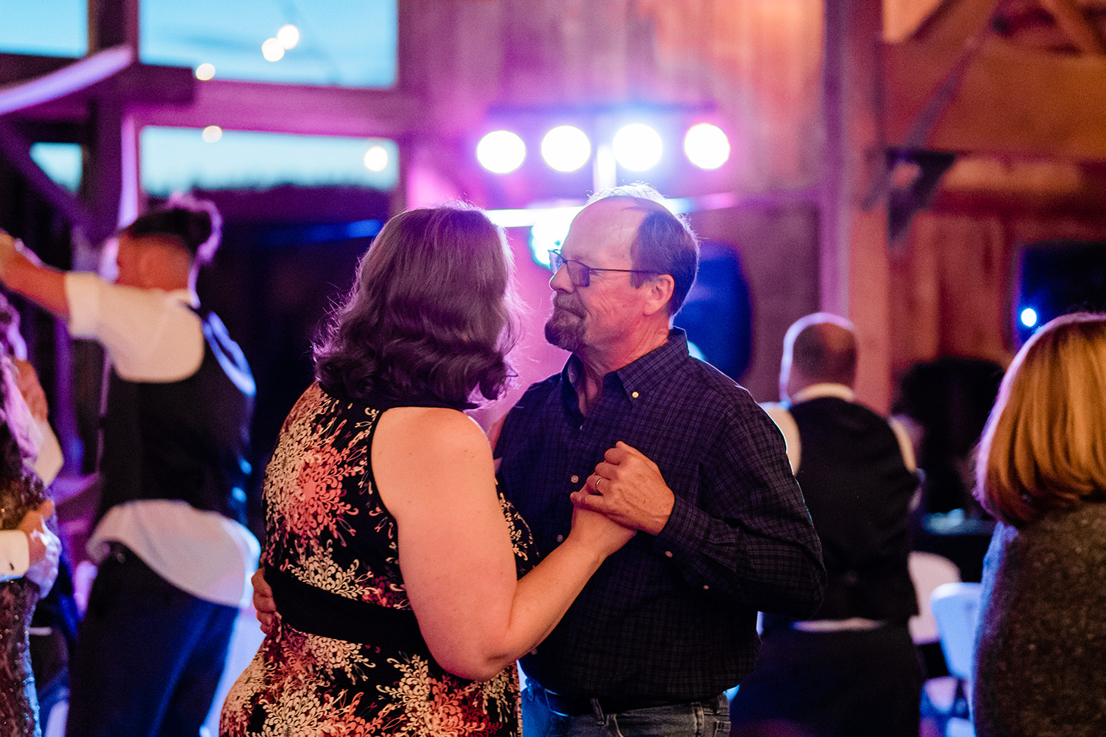 Husband and wife dancing at a Cattle Barn Wedding