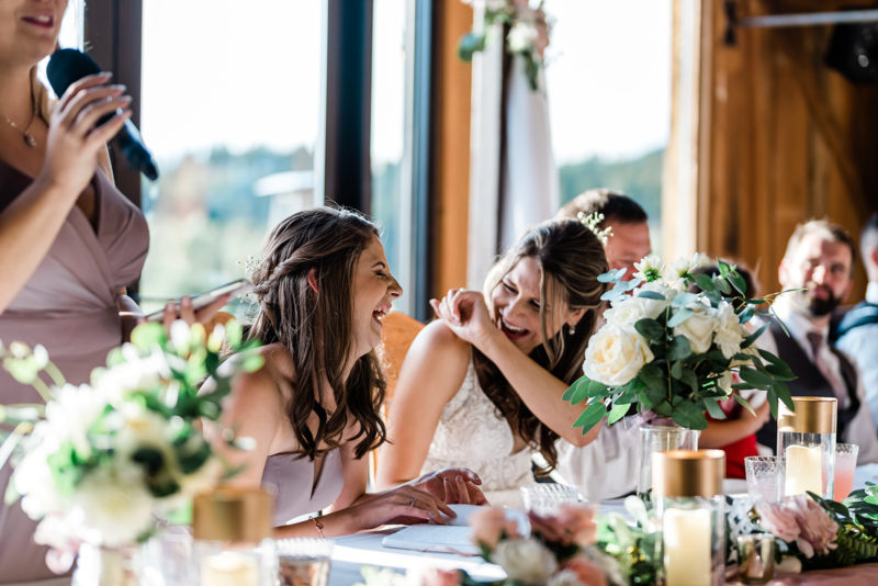 Bride laughing at a Cattle Barn Wedding