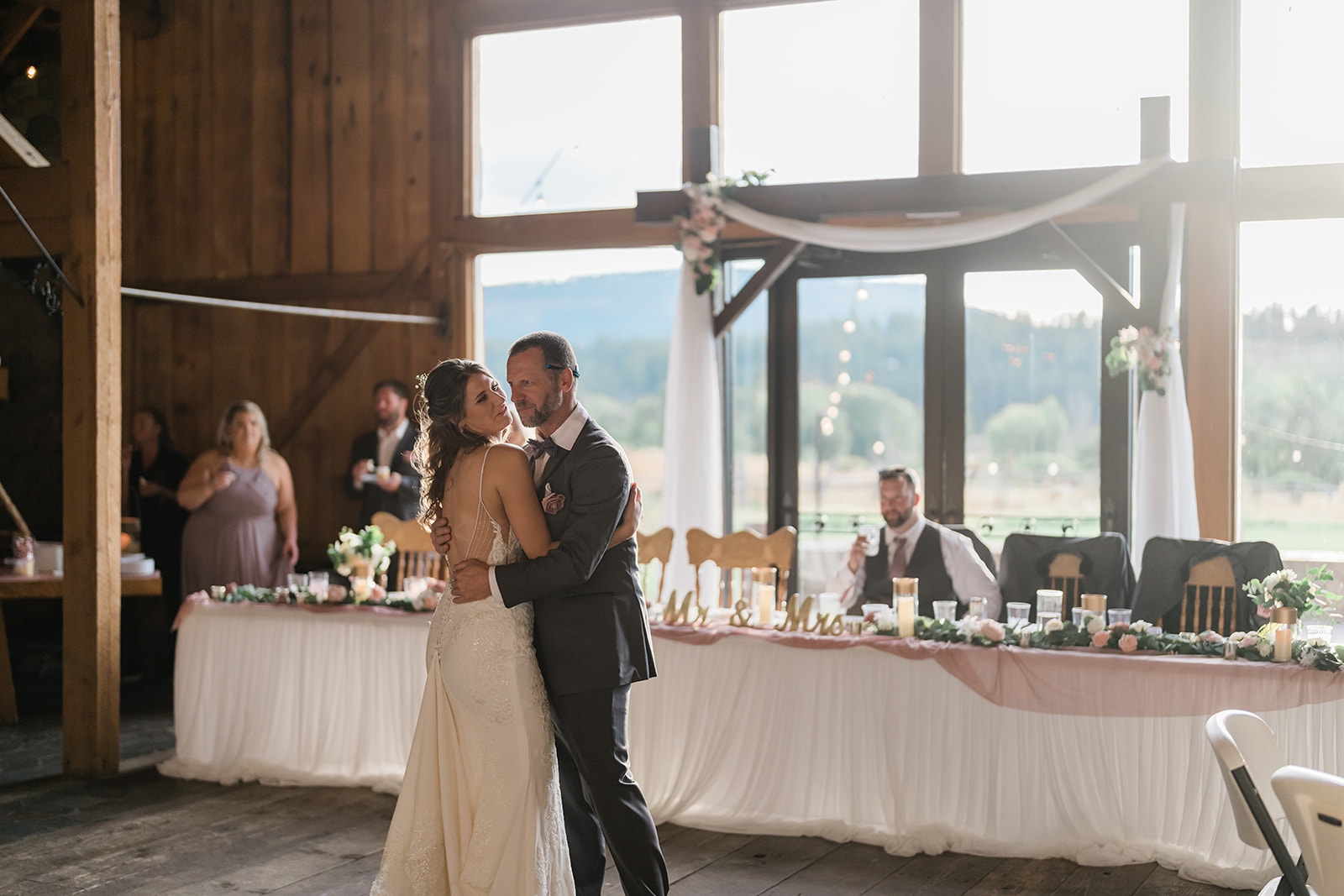 Groomsman and Bride dancing at a Cattle Barn Wedding