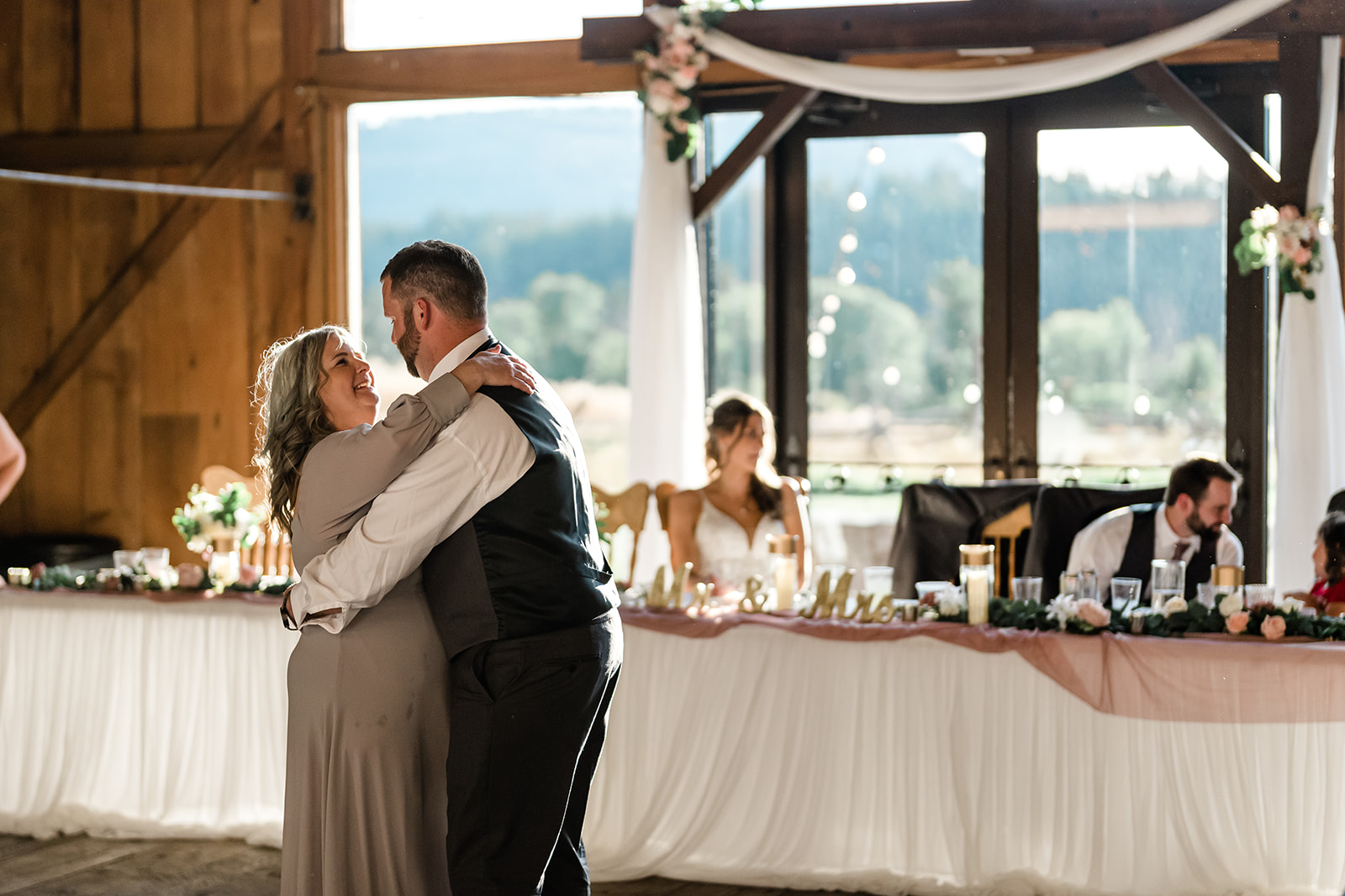 Groom and Mother dancing at a Cattle Barn Wedding