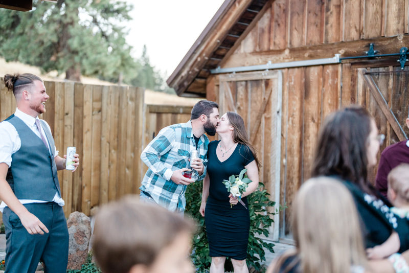 Bride throwing her flower at a Cattle Barn Wedding