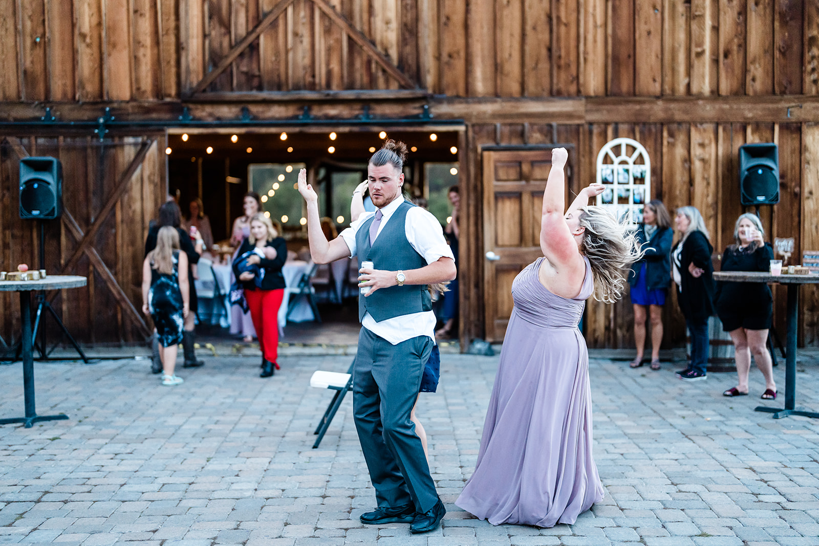 Guest dancing at a Cattle Barn Wedding