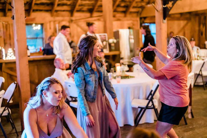 Bride dancing at a Cattle Barn Wedding