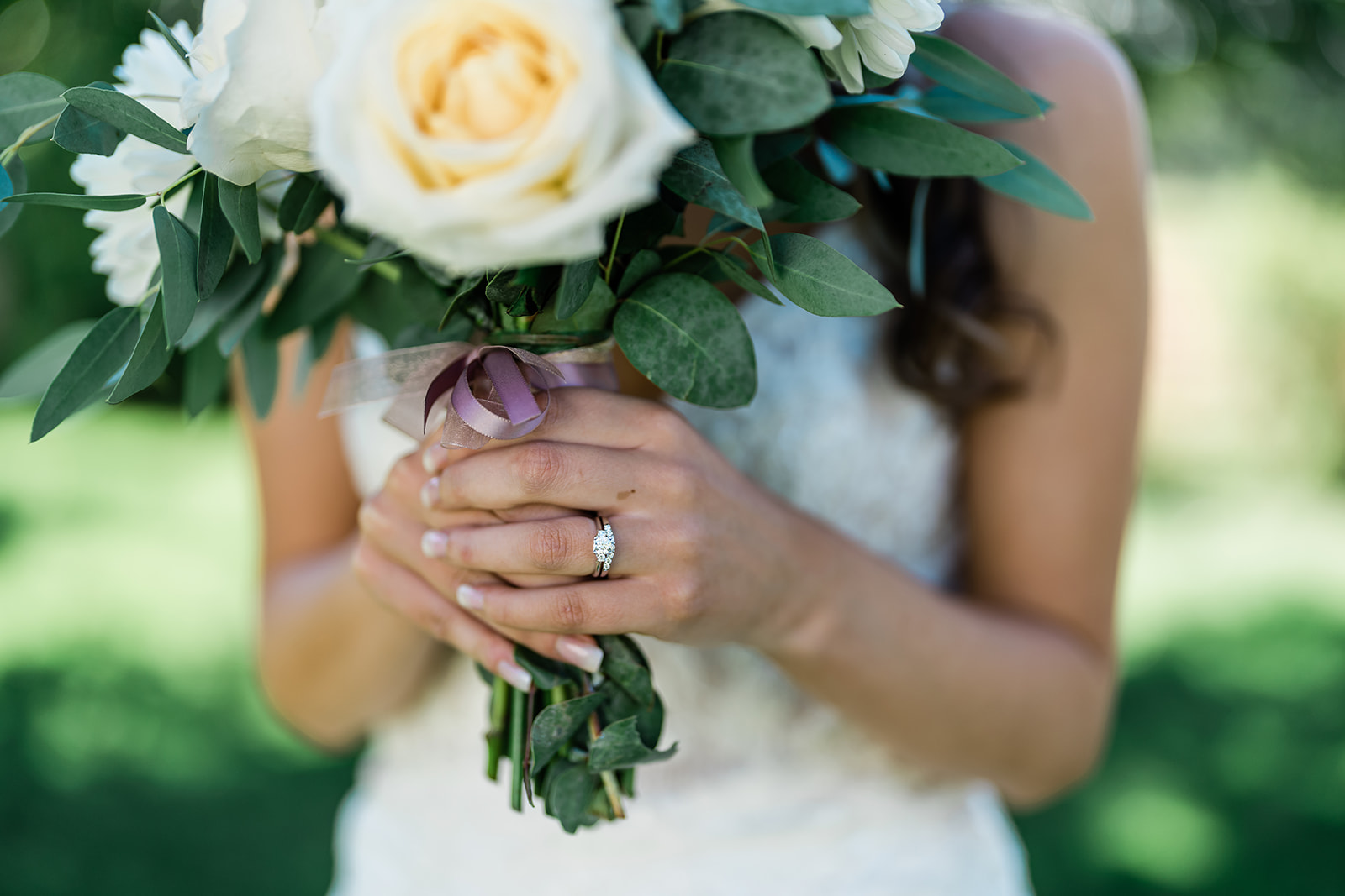 Bride holding her wedding flower at a Cattle Barn Wedding