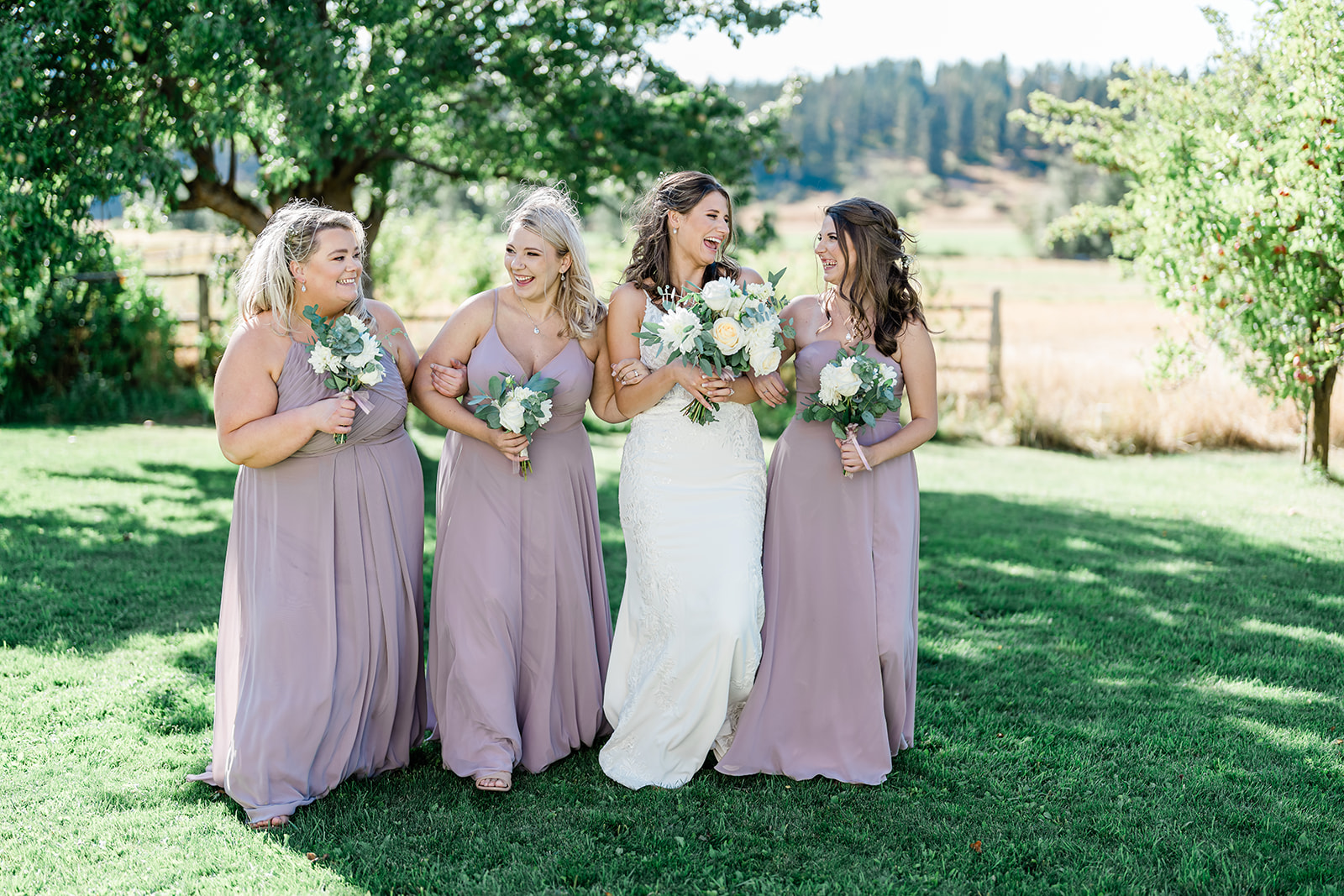 Bridesmaid and Bride at a Cattle Barn Wedding