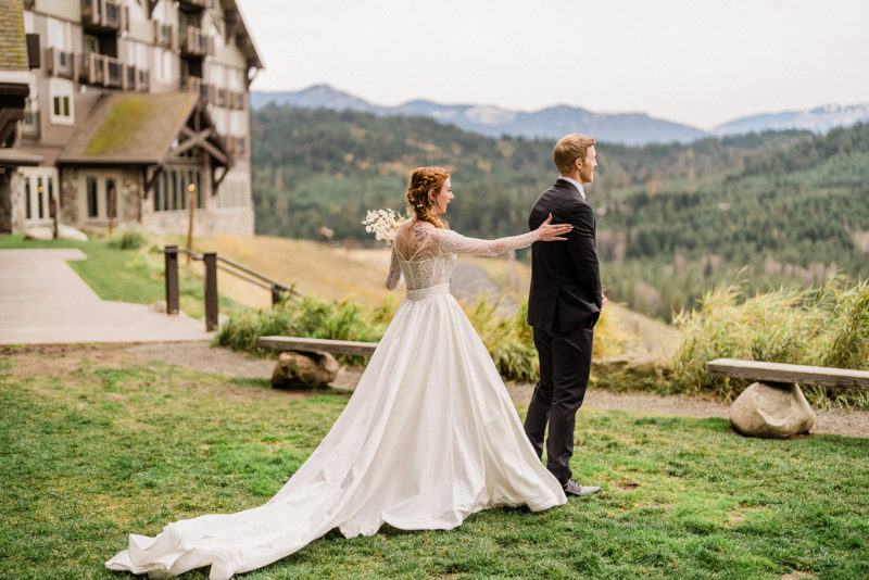 Bride reveals dress to groom outside Swiftwater Cellars
