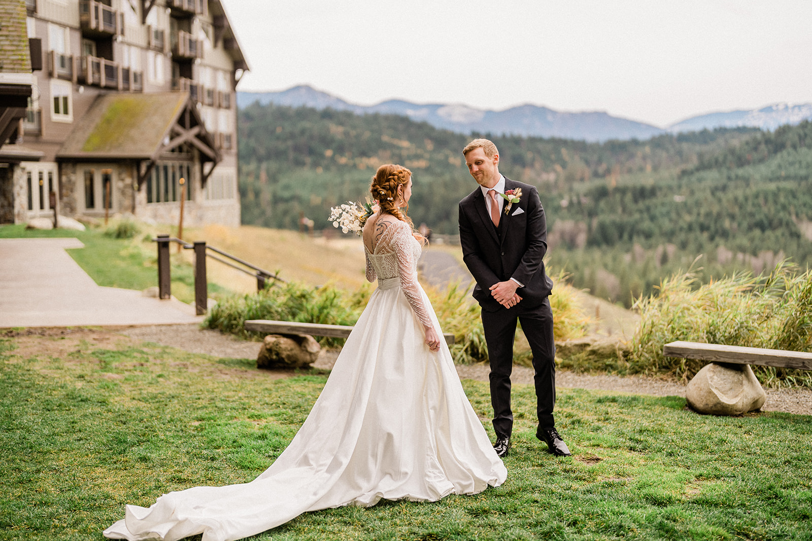 Bride and groom look lovingly outside at Swiftwater Cellars