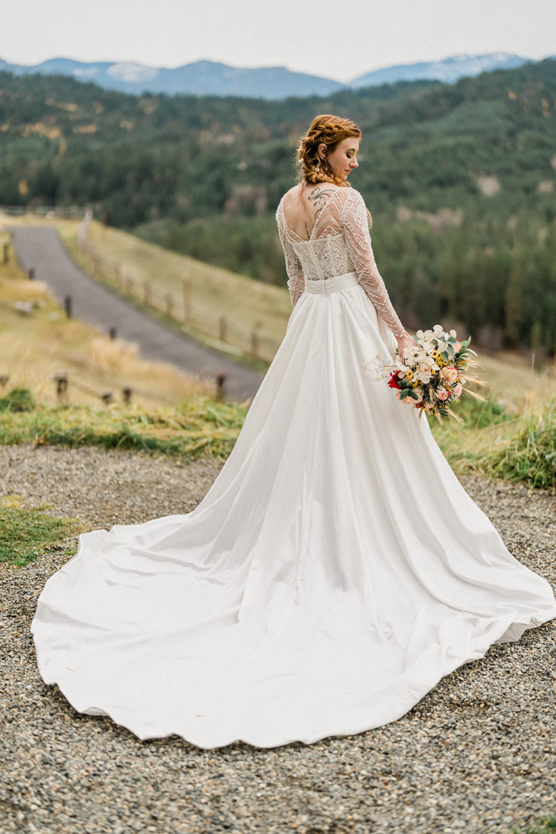 Bride over-the-shoulder look outside at Swiftwater Cellars