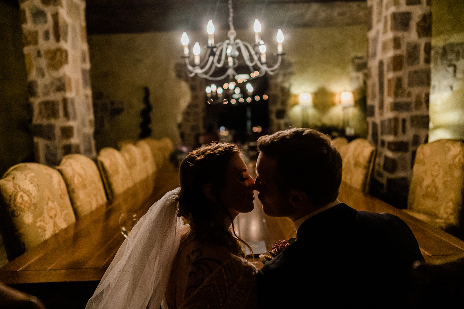 Bride and groom almost kiss inside Swiftwater Cellars