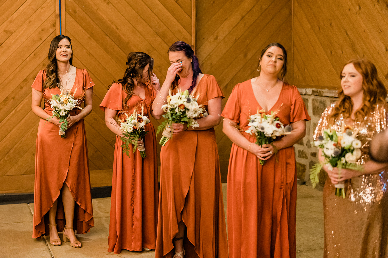 Emotional bridesmaids inside Swiftwater Cellars