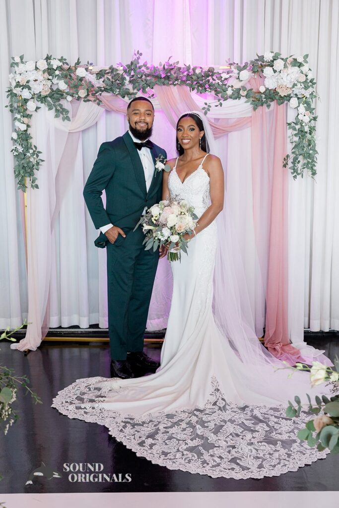 Newlyweds pose together at Briza on the Bay Wedding