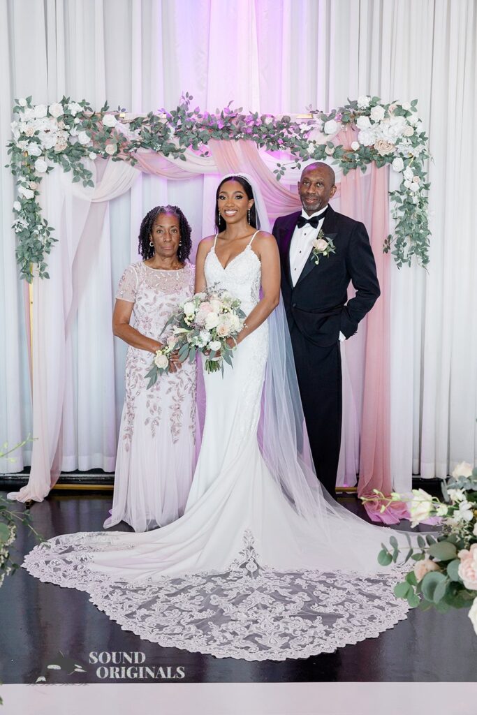 Bride with her parents at Briza on the Bay Wedding