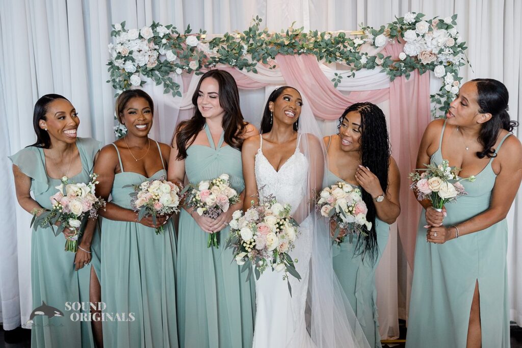 Bride shares fun moment with her bridesmaids at Briza on the Bay Wedding