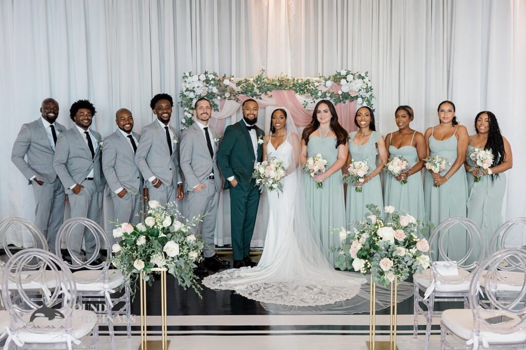 Newlyweds with the groomsmen and bridesmaids at Briza on the Bay Wedding