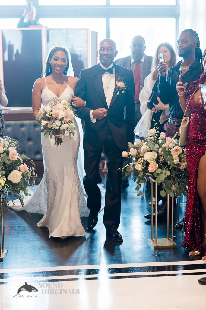 Bride walks down the aisle with father at Briza on the Bay Wedding