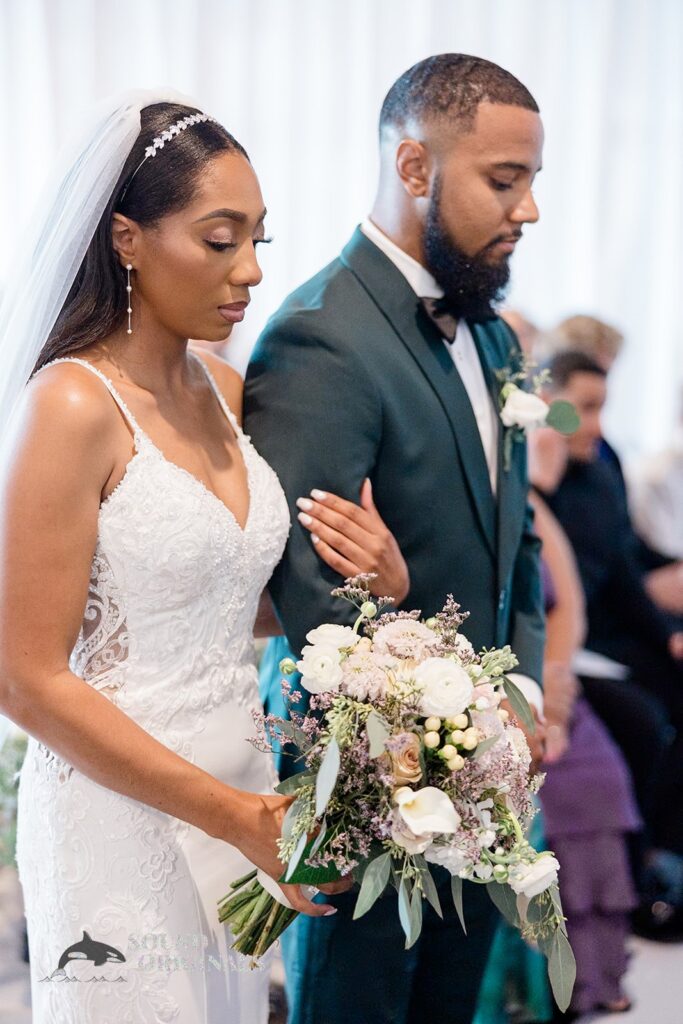 Bride and groom arm to arm at Briza on the Bay Wedding