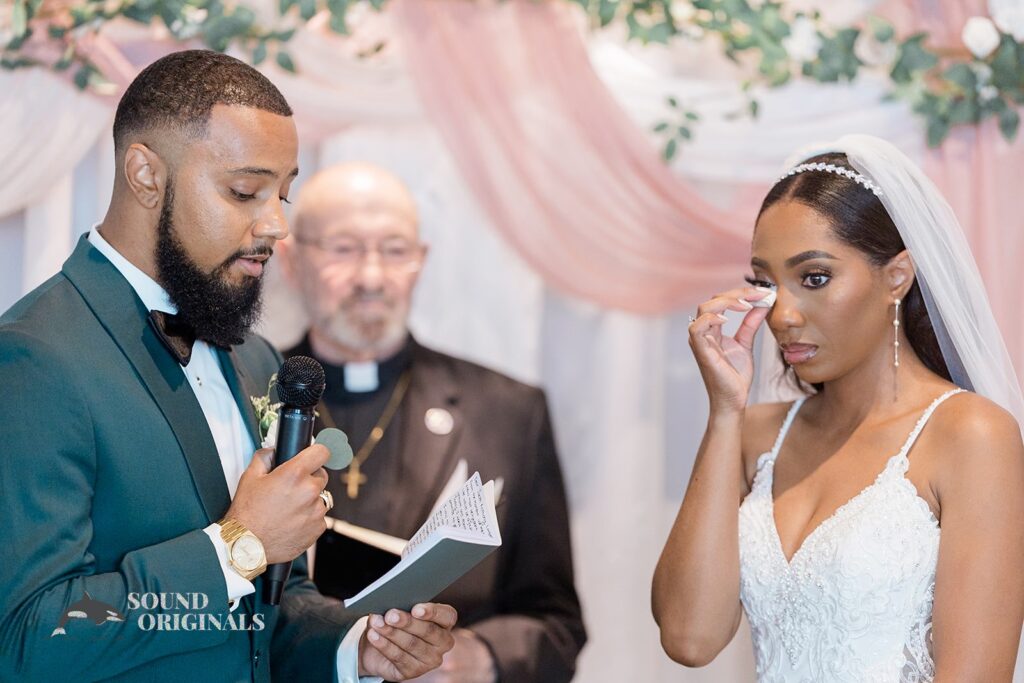 Bride teary eyed hearing groom&#039;s vows at Briza on the Bay Wedding