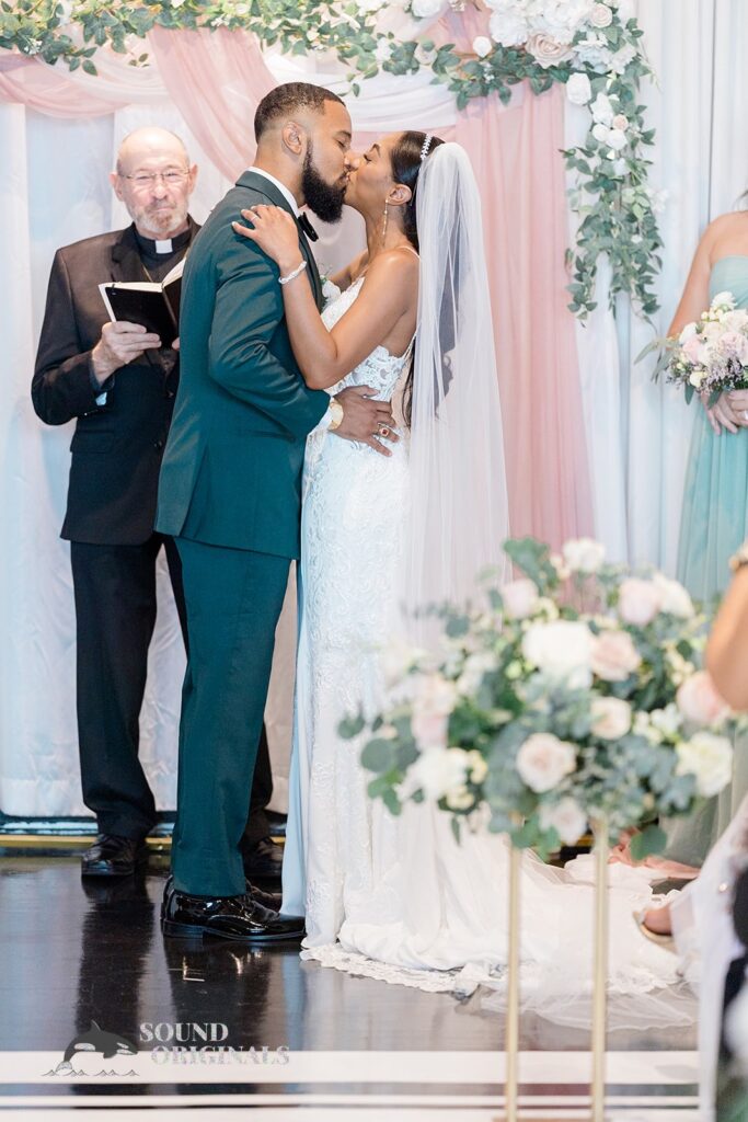 Bride and groom kiss at Briza on the Bay Wedding