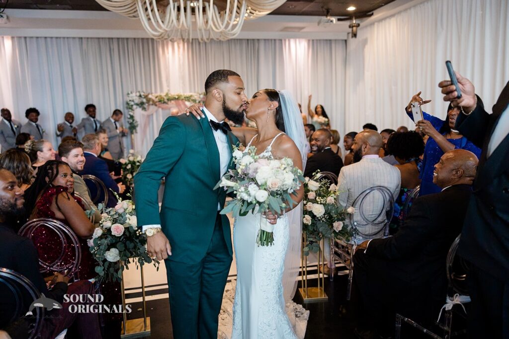 Newlyweds kiss at Briza on the Bay Wedding