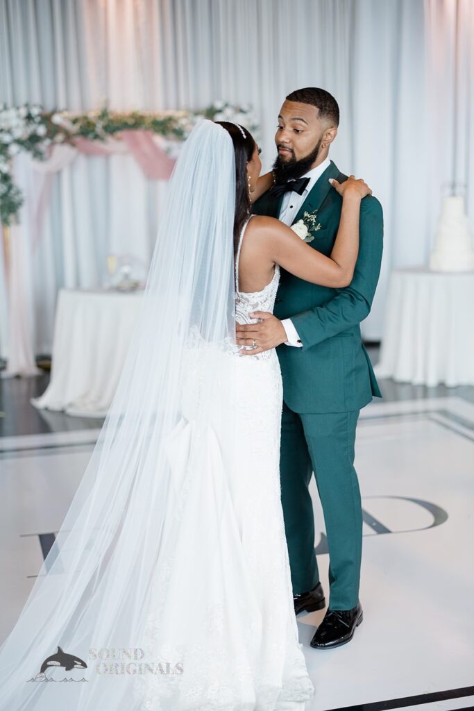 Newlyweds gazing at each other while dancing at Briza on the Bay Wedding