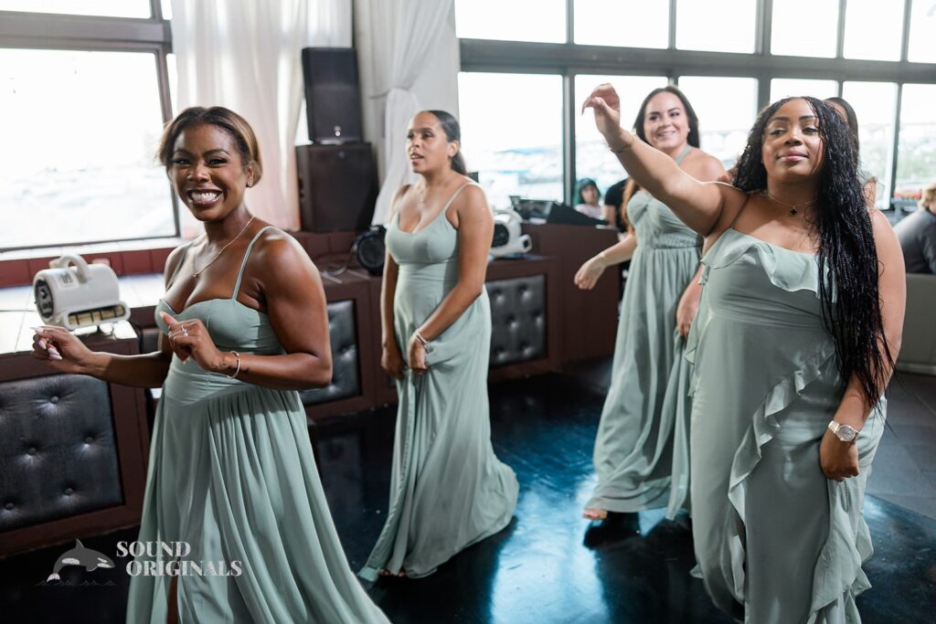 Bridesmaids make their entrance at the reception hall at Briza on the Bay Wedding