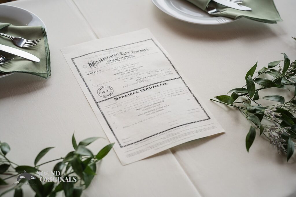 Photographer captures marriage certificate of couple in Evergreen Lake House Wedding