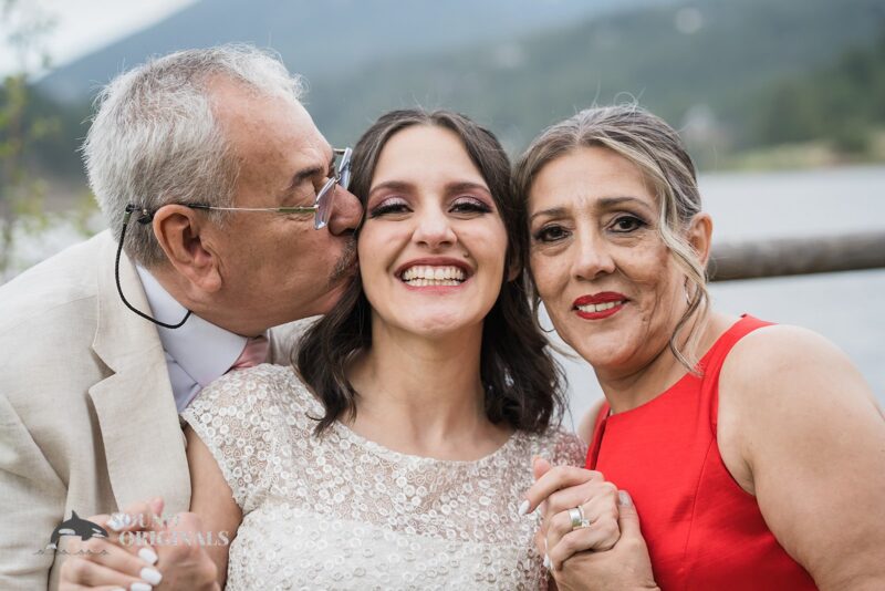 Beautiful bride shares charming moment with Mum and Dad in Evergreen Lake House Wedding