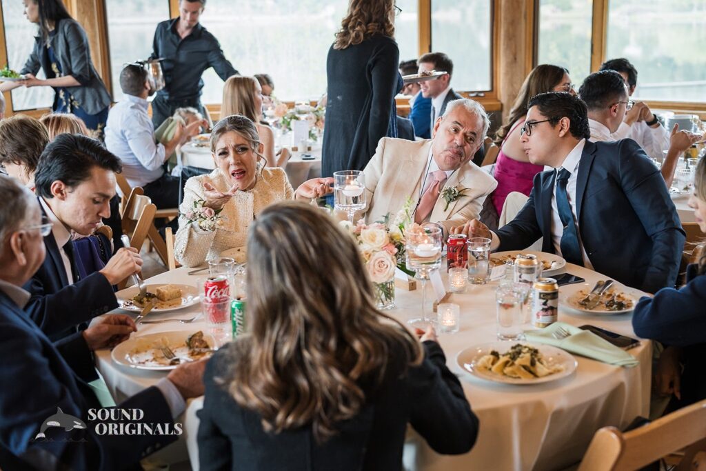 Photographer captures bride&#039;s family enjoying the sumptuous delicacies served in Evergreen Lake House Wedding