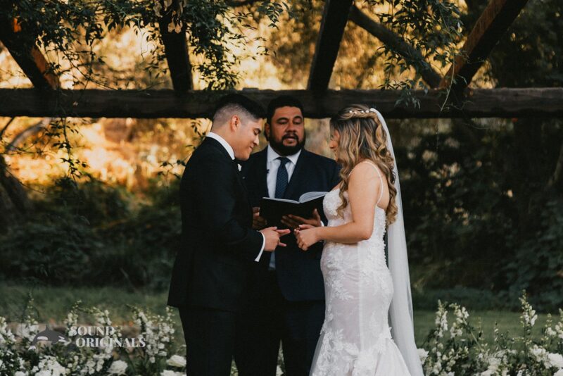 Pretty bride and groom exchange marital vows in The Havens Country Club Wedding