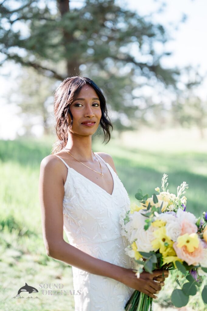 Gorgeous photo of the bride with her bouquet at The Red Farmhouse Bed & Breakfast Wedding