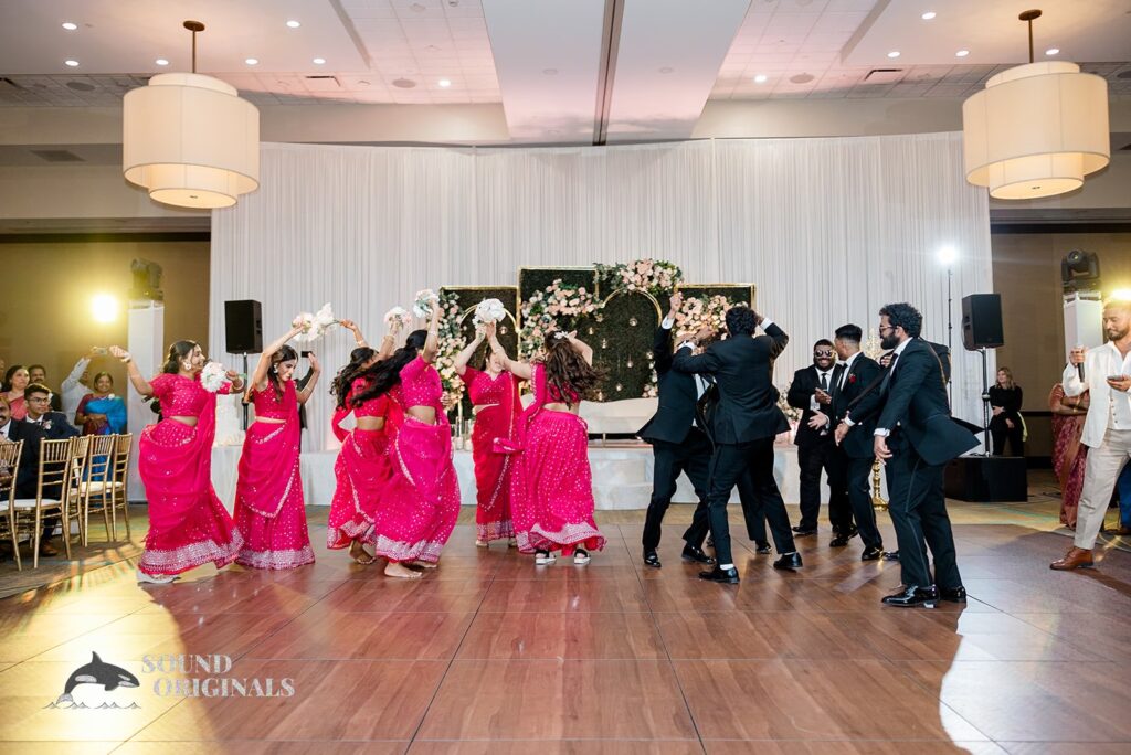 The bridesmaids and groomsmen on the dance floor at Embassy Suites by Hilton Naperville Wedding