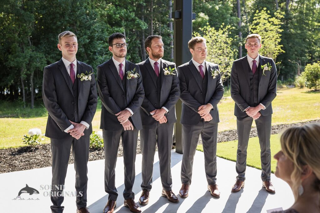 The groomsmen waiting at the altar at The Oakley on the Lake Wedding